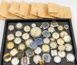 A mixed collection of vintage gents and ladies wrist watches, no straps, unchecked.