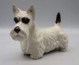 A Beswick dog figure, marked underneath to one foot.