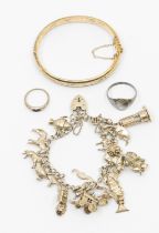 A collection of silver jewellery to include various chains, pendants, along with a charm bracelet