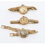 Two early 20th century 9ct gold cased wristwatches, including one with a 9ct gold strap the others
