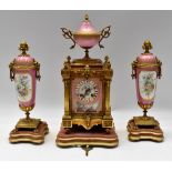 A mid 19th Century French bronze porcelain plague 8 day mantle clock with pink and gilt porcelain