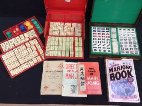 ***WITHDRAWN*** A 20th century Mahjong set in red paper case, pieces made of bone, different