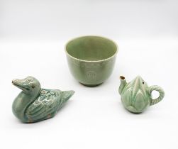 Three pieces of Korean celadon glazed stoneware to include: 1. a bowl with clay inlaid birds and