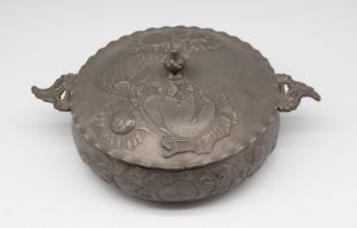Kayserzinn - A pewter twin handled pudding dish and cover, having cast flower sprays and foliage