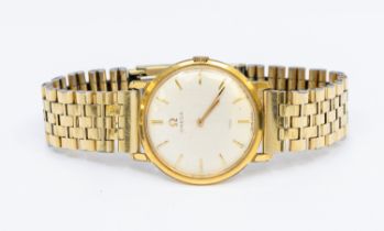 Omega- a gentleman's gold-plated vintage wristwatch, comprising a signed round silvered dial with