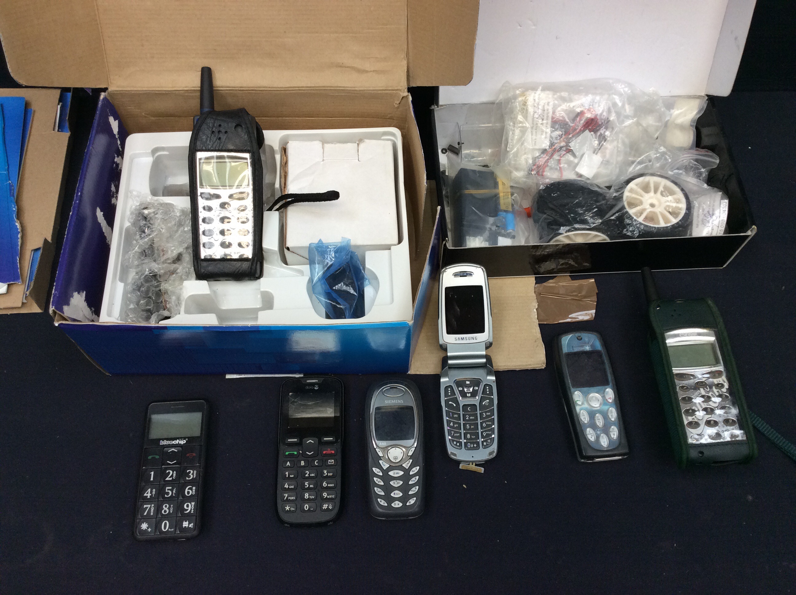 Vintage 1990's and other mobile phones with accessories