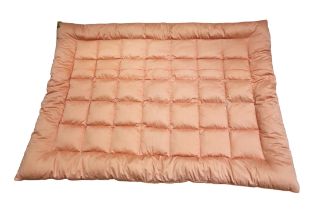 A pale peach quilted eiderdown with a pale pink underside, early to mid 1950s, singe size.