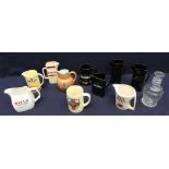 A collection of mixed modern pub jugs and containers by various manufacturers.