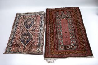 Two Persian Shiraz red ground rugs, mid 20th Century, 133cm x 89cm - 120cm x 84cm.