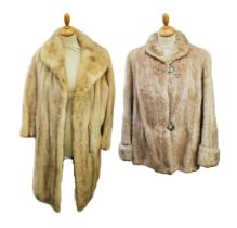 A blond mink coat by P Work in Jura, this full length coat had a cowl collar and hook fastening (