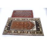 A Western Persian prayer rug with floral flowering plants and crab detail, floral borders, browns,