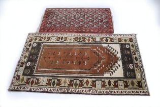 A Western Persian prayer rug with floral flowering plants and crab detail, floral borders, browns,