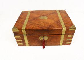 A Victorian mahogany writing box with brass strapping and bottle green leather writing surface,