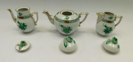Three pieces of Herend porcelain to include; tea pot, water pot and milk/cream jug with cover, all