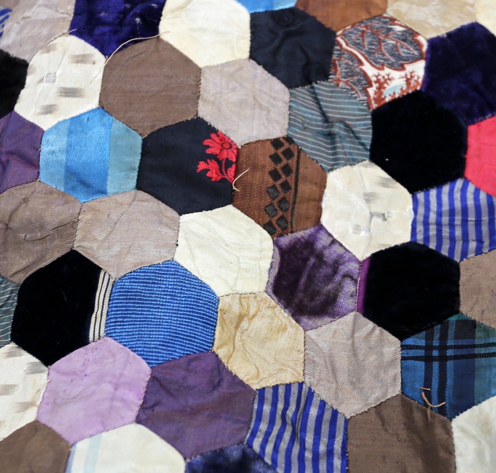 A very unusual silk quilt, c1870/80, hexagon shaped patches in a colourway of blues/gold/cream plain - Image 6 of 9
