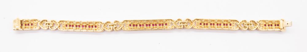 A ruby and diamond 18ct gold bracelet, comprising elongated panels, each set to the centre with a - Bild 3 aus 5