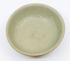 A Song style celadon green bowl with circular footed base, approx. 17cm diameter x 5.5cm high.