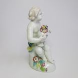 A Derby Cherub holding a pot of flowers. Circa; 1760 Size; height 17.5cm Condition; restoration to