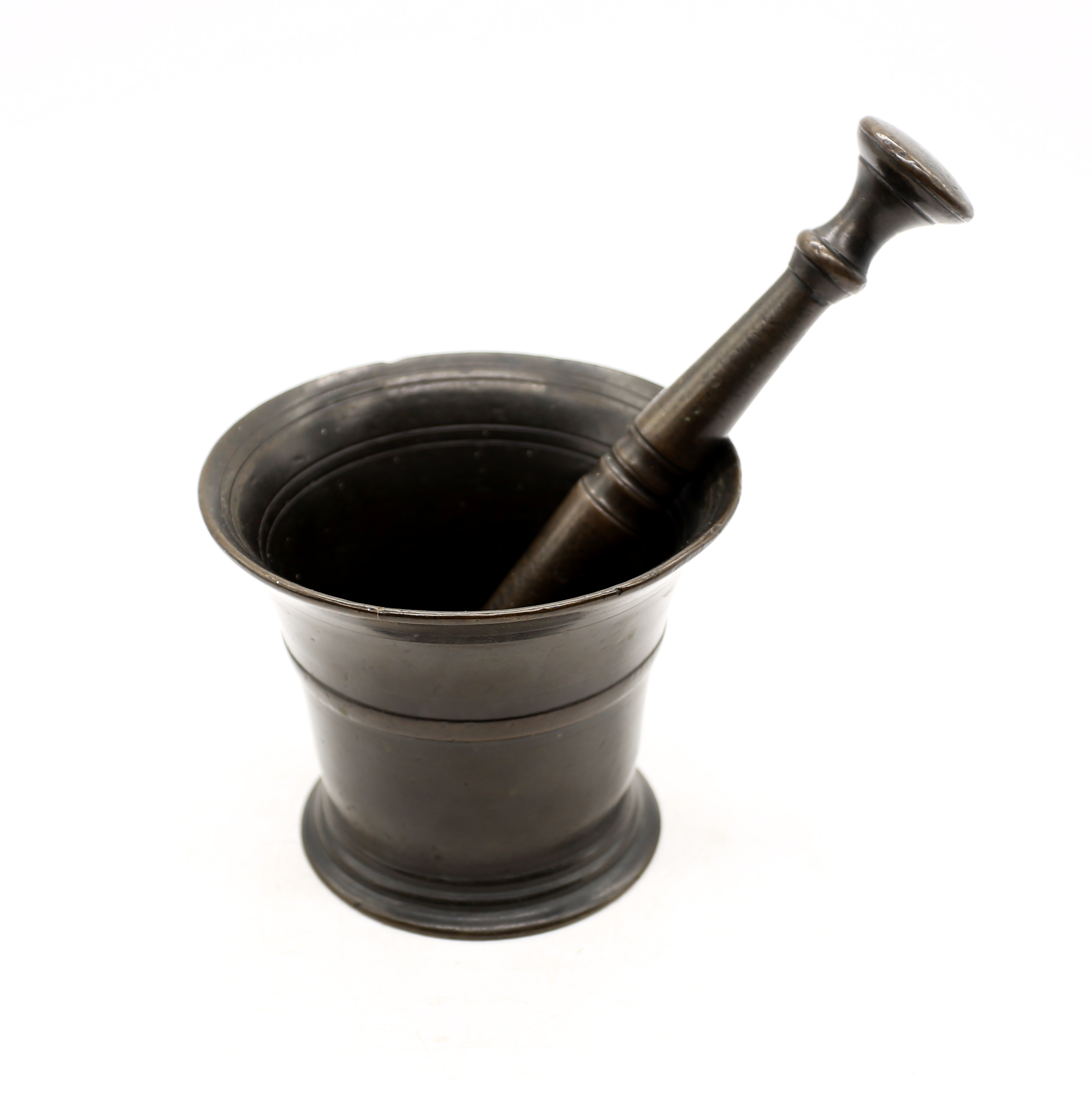 A late 17th century bronze pestle and mortar: mortar approximately 11cm high, pestle approximately