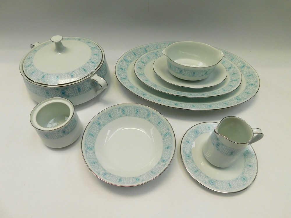 A part Noritake Linley pattern dinner service in blue and white floral border, marked to reverse,