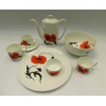 A Susie Cooper Wedgewood corn poppy part coffee service with bowl and large plates,