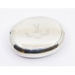 A George VI oval silver snuff box, with engraved stags head crest to hinged cover, hallmarked by D