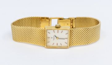 Tissot- a ladies 18ct gold Tissot wristwatch, comprising a silvered rectangular dial with applied