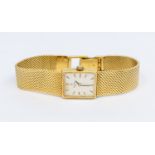 Tissot- a ladies 18ct gold Tissot wristwatch, comprising a silvered rectangular dial with applied