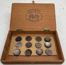 A set of 12 black lip oyster buttons with note to verso stating they belonged to Queen Victoria,
