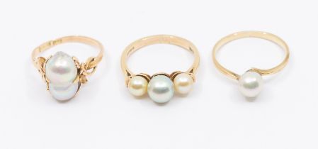 Three pearl set rings, to include a 14ct gold single grey coloured double pearl set ring, size N,