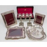 A collection of silver plated wares to include; three Carrs of Sheffield silver plated photo frames,