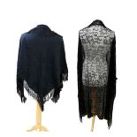 A black silk mowry shawl, early 1900s, embroidered corner and silk tassels (some holes), a black