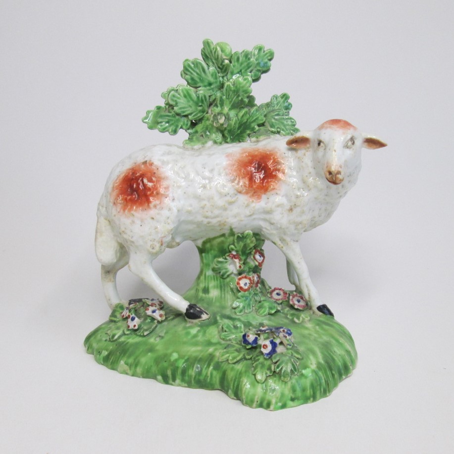 A Derby figure of a ewe standing before bocage Circa;1800 Size; height 14cm, width 13cm Condition;