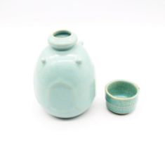 An Asian faceted blue glazed crackle ware Jun ware bottled base with four bosses, 12th Century