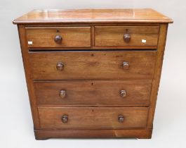 A mid 19th Century mahogany chest of two over three with knot wooden handles.