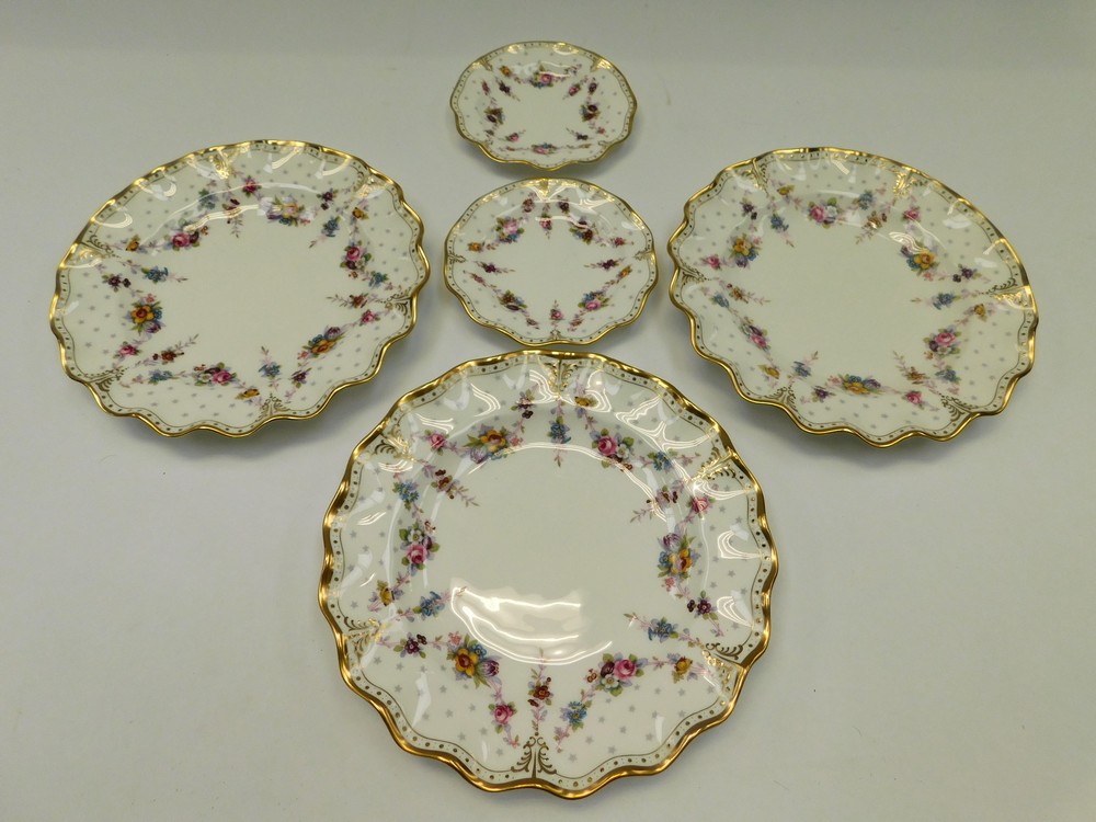 Royal Crown Derby: Three Royal Antoinette fluted edged dinner plates (one a second), and two smaller