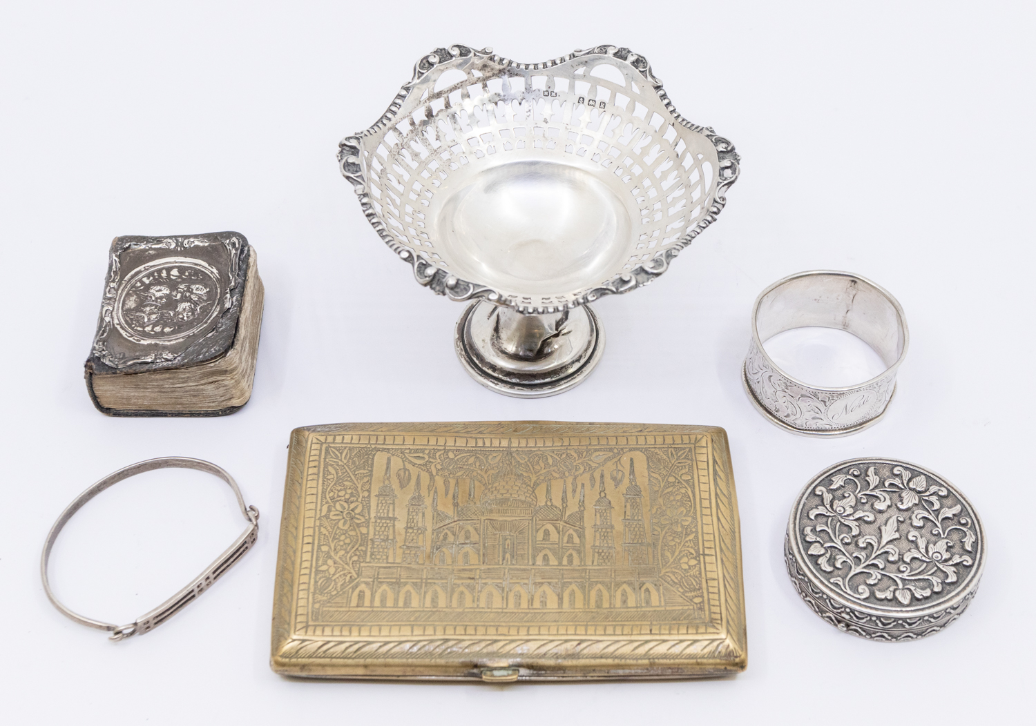 A collection of silver and white metal items to include; an Edwardian silver small bonbon dish, on