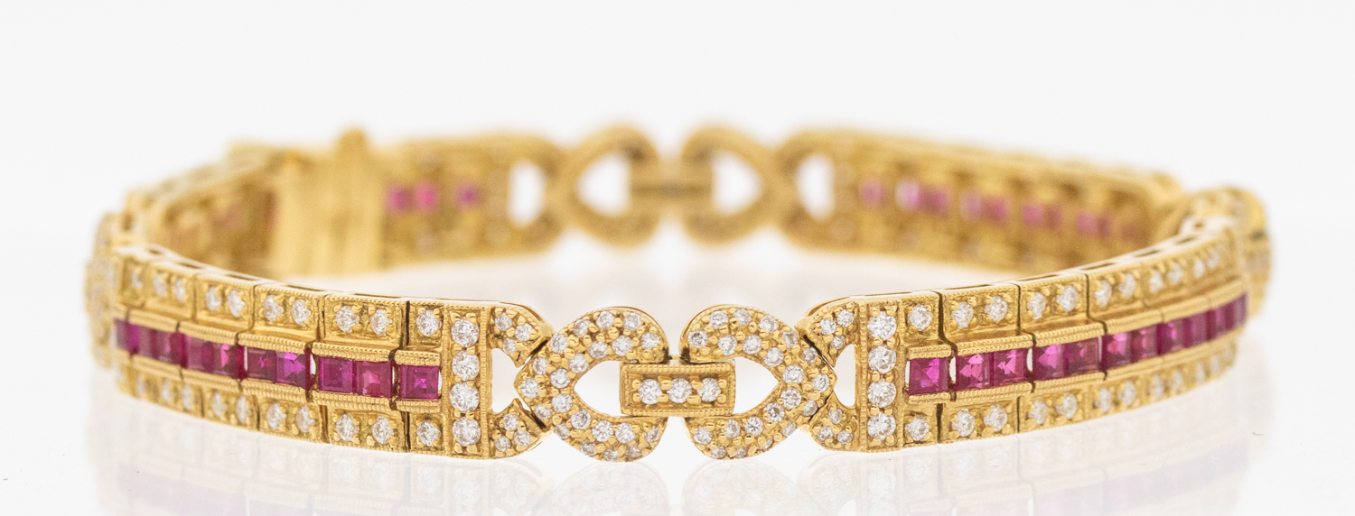 A ruby and diamond 18ct gold bracelet, comprising elongated panels, each set to the centre with a - Bild 4 aus 5
