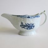 A Lowestoft sauce boat floral printed Circa 1765 Length 17cm Condition; crack in base