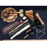 A collection of musical instruments to include recorders, tambourines, pan pipes, triangle,