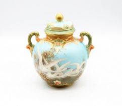Charles Baldwin: a Royal Worcester two handled pot pourri vase and cover, shaped no: 1515, the front