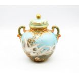 Charles Baldwin: a Royal Worcester two handled pot pourri vase and cover, shaped no: 1515, the front