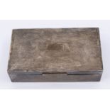 A mid 20th century rectangular engine turned silver cigarette box, cedarwood interior with