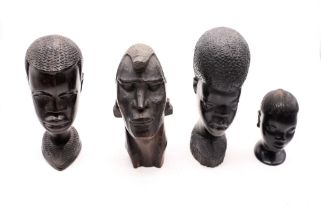 Four East African carved ebony native busts.