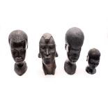 Four East African carved ebony native busts.