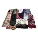 A large collection of silk squares and scarves in rayon and man-made fibres. An interesting lot that