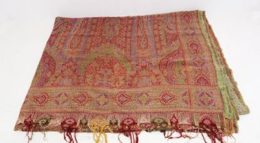 A very large paisley shawl or bed cover, wool tassels (some missing, some holes and some wear and