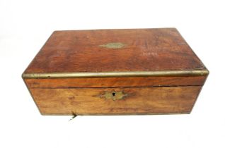 A 19th Century mahogany writing box with brass supports.