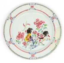 A large Chinese Famille Rose charger, with bianco-sopra bianco boarders, painted with cockerels in