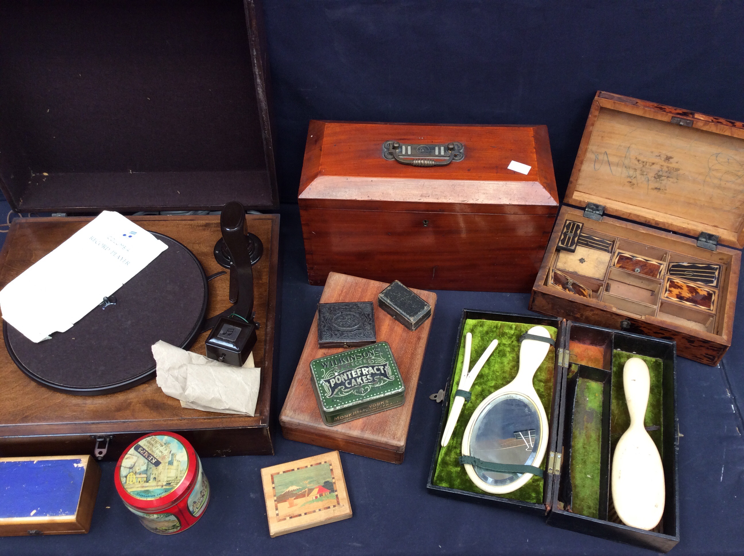 A mid 20th Century table top record player along with a collection of trinket and other boxes.